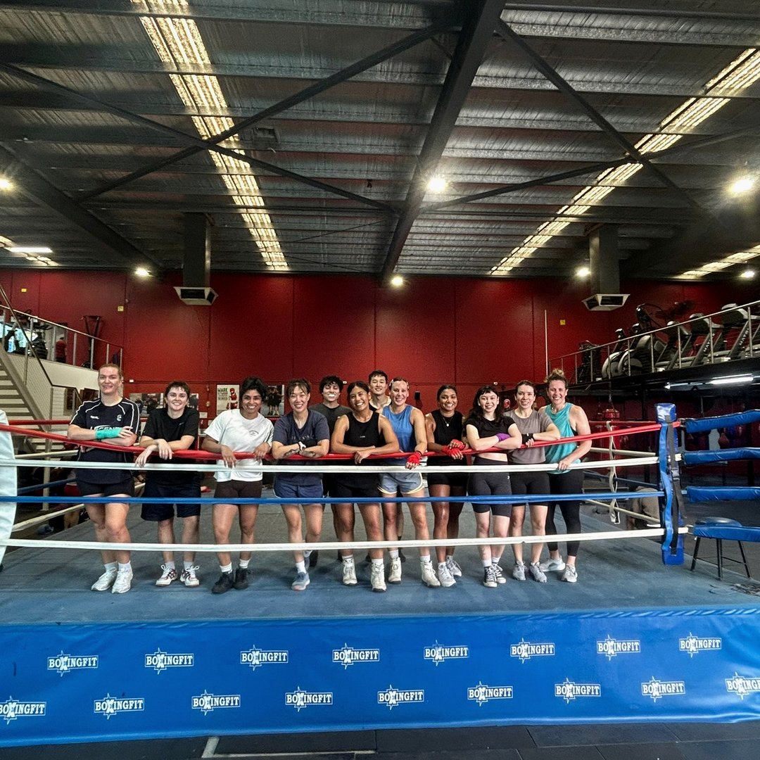 Women's group lined up at the boxing ring